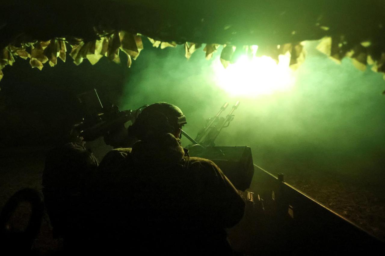 Ukrainian servicemen from an anti-drone mobile air defence unit fire a ZU-2 anti-aircraft cannon during combat shift on the front line in the Donetsk region