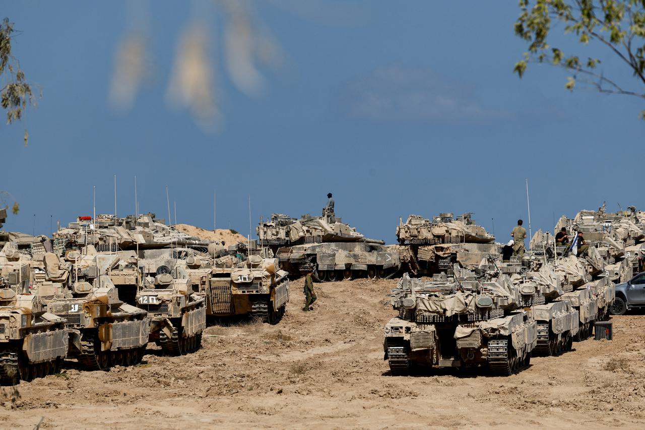 Israeli soldiers, tanks and armoured personnel carriers (APCs) near the Israel-Gaza border