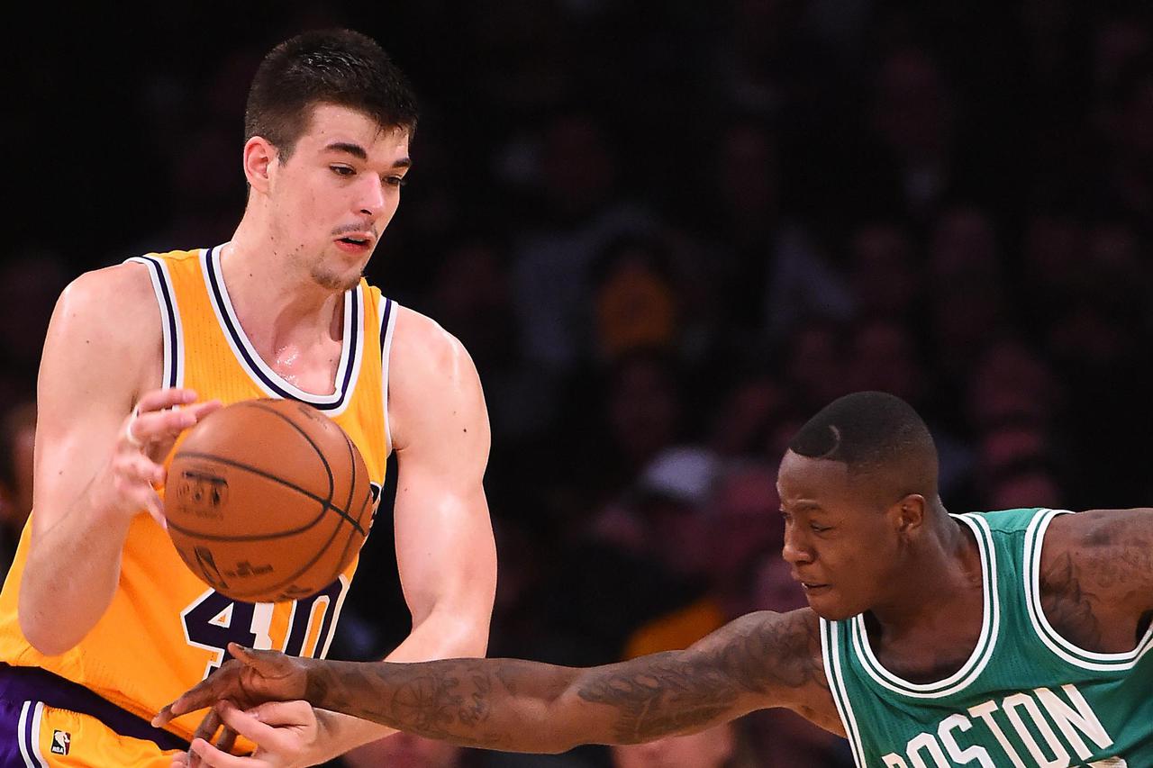 NBA: Boston Celtics at Los Angeles Lakers Mar 3, 2017; Los Angeles, CA, USA; Boston Celtics guard Terry Rozier (12) knocks the ball from the hands of Los Angeles Lakers center Ivica Zubac (40) in the second half of the game at Staples Center. The Celtics