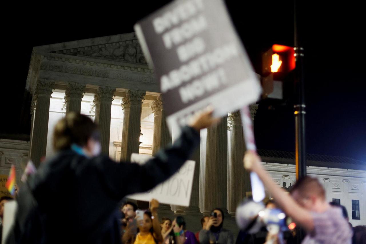 Protesters react outside the U.S. Supreme Court after the leak of a draft opinion preparing for a majority of the court to overturn the Roe v. Wade abortion rights decision in Washington