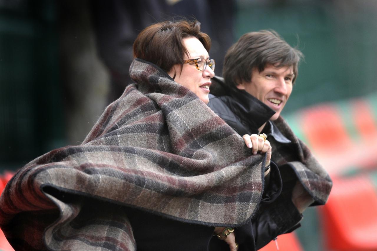 'Olga Smorodskaya, FC Lokomotiv President, and Aleksei Smertin, the FC Lokomotiv president\'s adviser on selection policies, watching the team\'s work-out.'