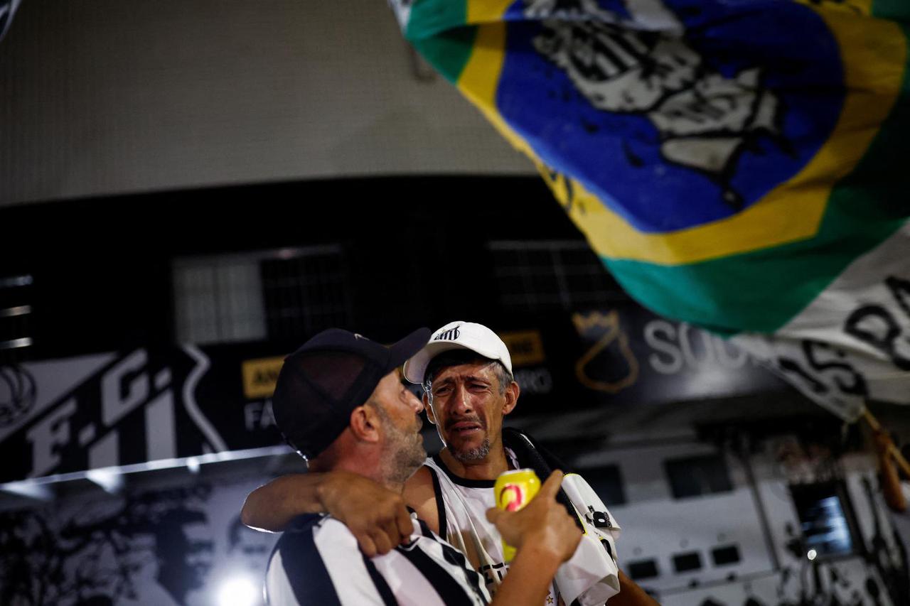 People mourn the death of Brazilian soccer legend Pele, in Santos