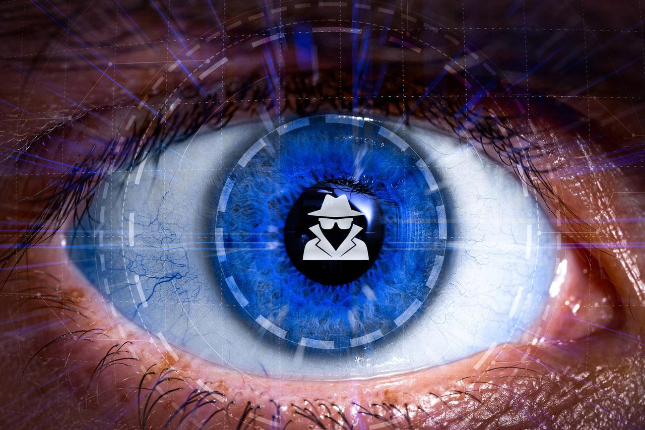 Bavaria, Germany - 01 June 2025: FOTOMONTAGE, A spy symbol in the center of a digitally superimposed eye visualizes the 