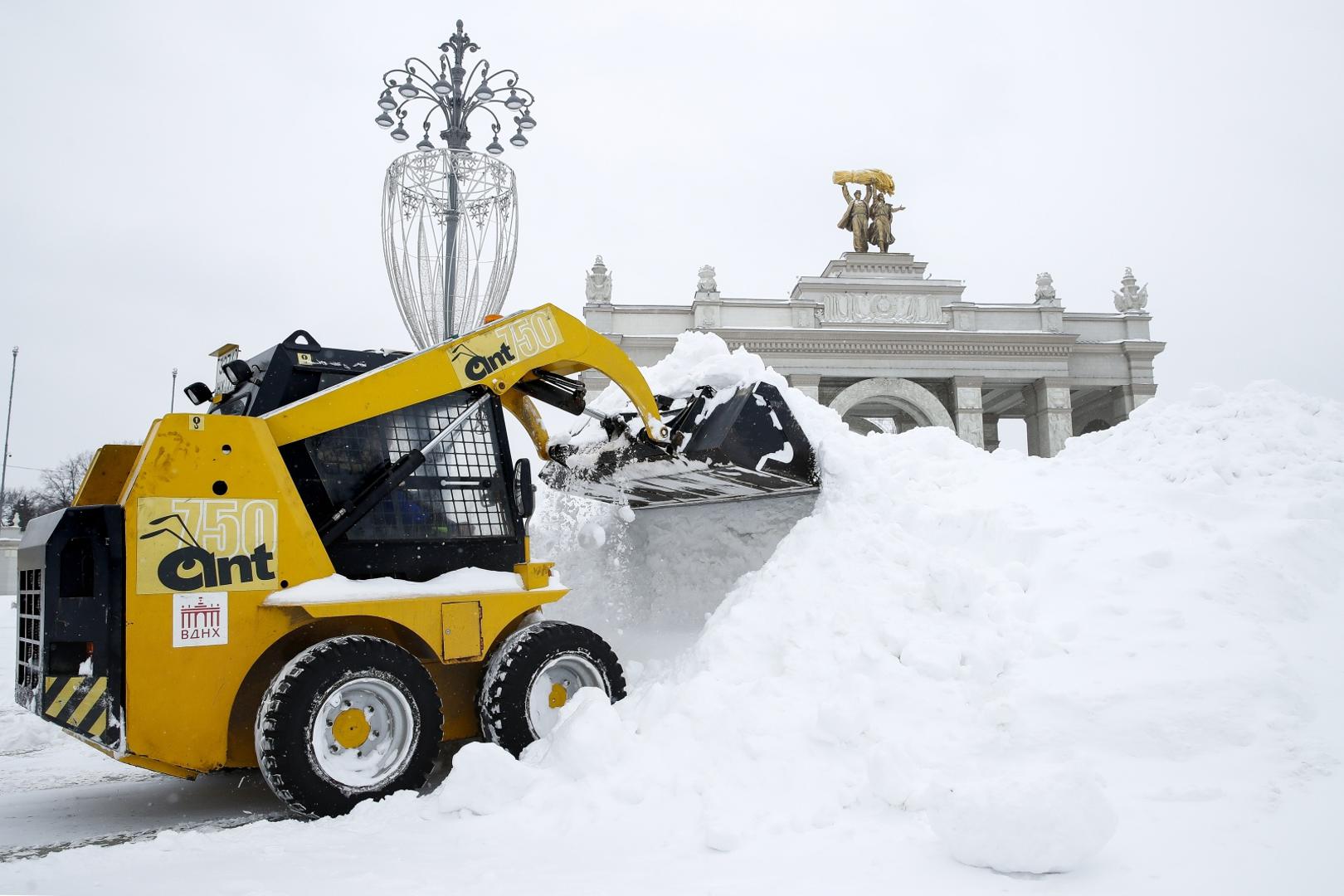 MOSCOW, RUSSIA - FEBRUARY 13, 2021: An excavator removes banks of snow near the main entrance arch of the VDNKh Exhibition Centre. Artyom Geodakyan/TASS Photo via Newscom Newscom/PIXSELL