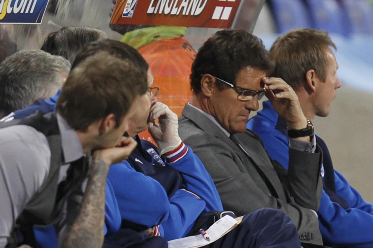 'England\'s coach Fabio Capello (2nd R) reacts during the 2010 World Cup second round soccer match against Germany at Free State stadium in Bloemfontein June 27, 2010.   REUTERS/Kai Pfaffenbach (SOUTH
