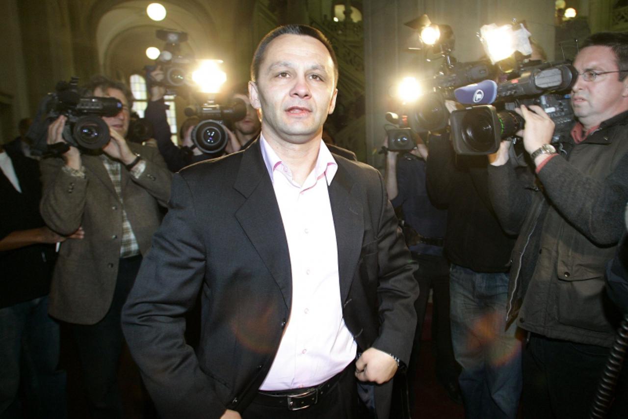 'File photo shows Milan Sapina as he arrives before a trial of German soccer referee Robert Hoyzer in a local court in Berlin, November 17, 2005. A match-fixing ring with more than 200 suspected membe