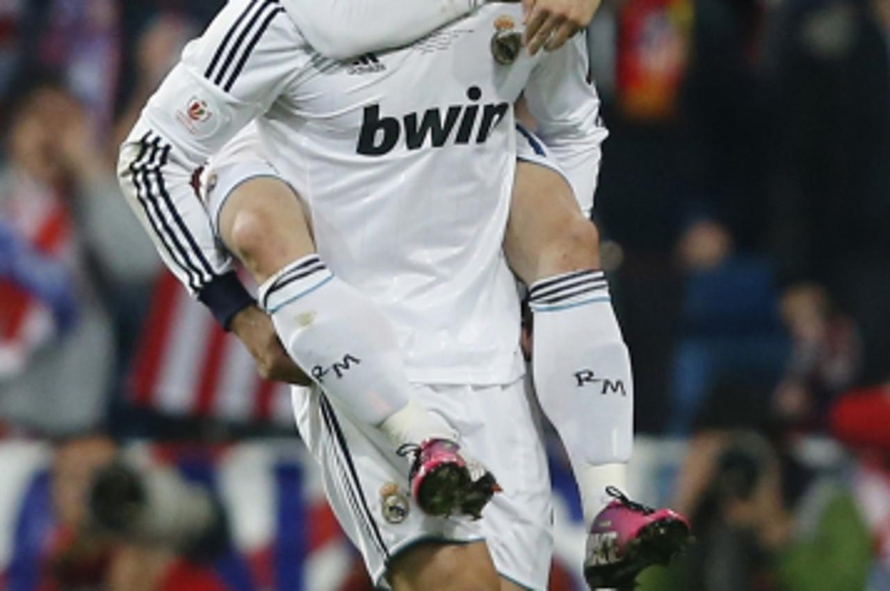 'Real Madrid\'s Cristiano Ronaldo celebrates with team mate Luka Modric (top) after scoring a goal against Atletico Madrid during their Spanish King\'s Cup final soccer match at Santiago Bernabeu stad