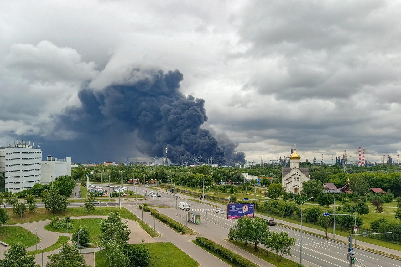 Smoke rises from an oil refinery following a Ukrainian drone attack in Moscow