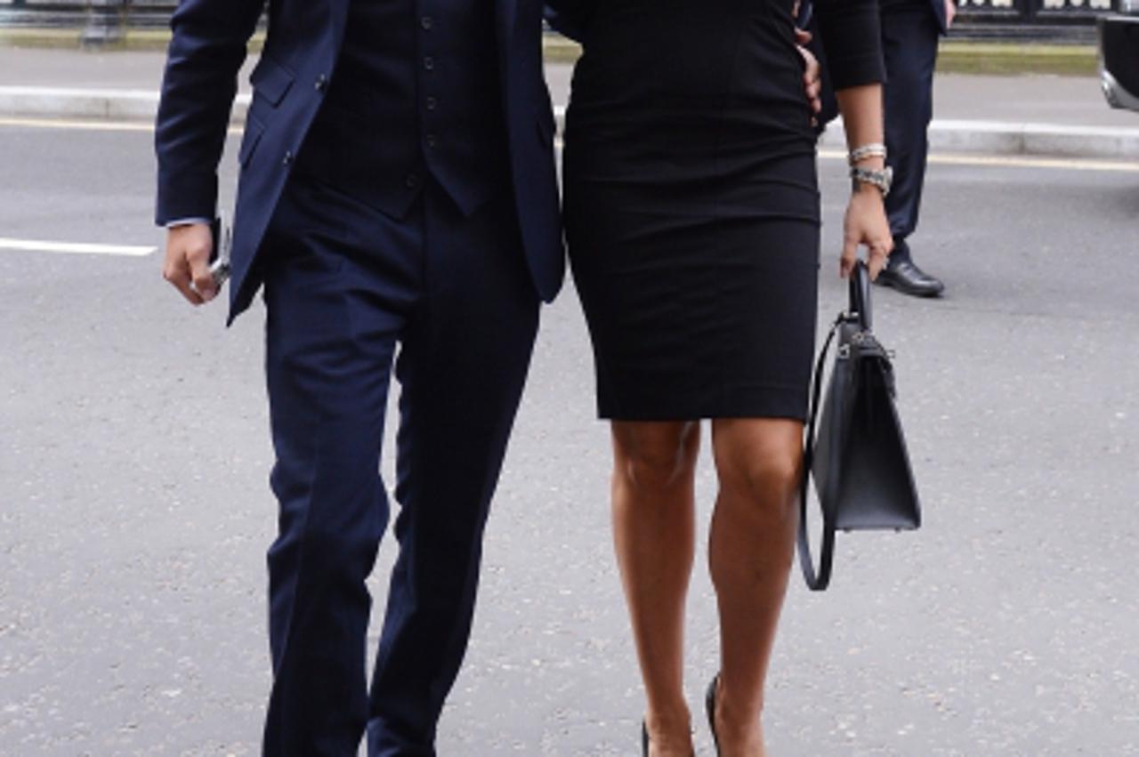 'Tamara Ecclestone arrives at the High Court in London today with Jay Rutland, where she is suing an ex-boyfriend who attempted to blackmail her.Photo: Press Association/PIXSELL'