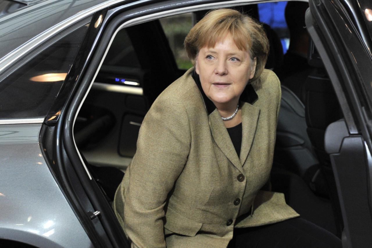 \'German Federal Chancellor Angela Merkel arrives for a European Union summit at the EU headquarters on January 30, 2012 in Brussels. European leaders bid to close a chapter in the debt crisis today w