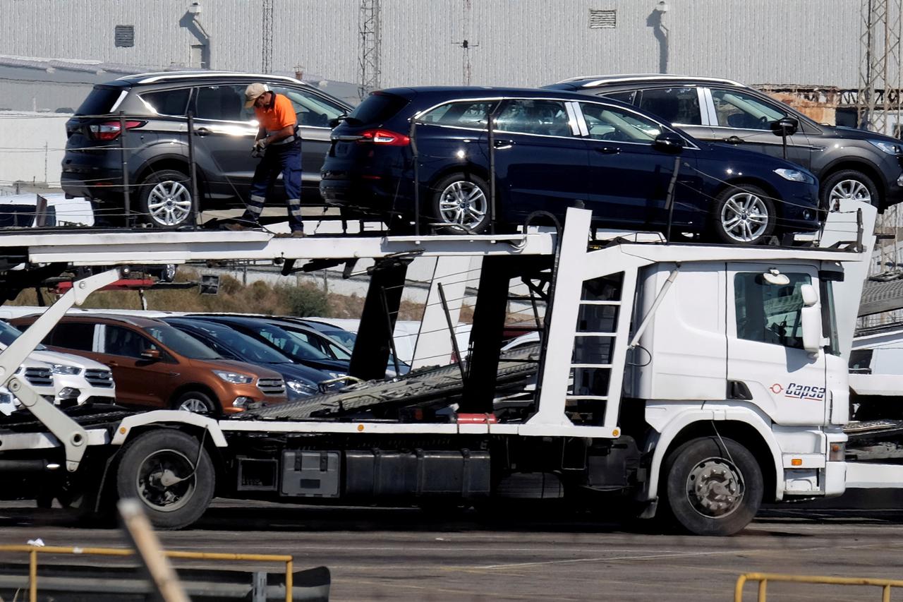 FILE PHOTO: Cars are being loaded onto a truck at the Ford factory in Almussafes near Valencia