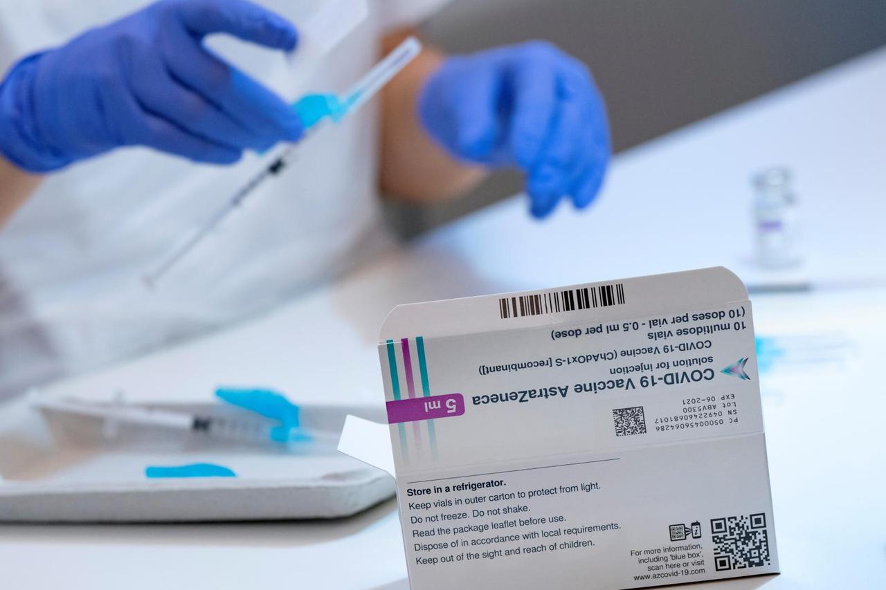 A box of the AstraZeneca COVID-19 vaccine is seen as syringes are filled at the Skane University Hospital vaccination centre in Malmo