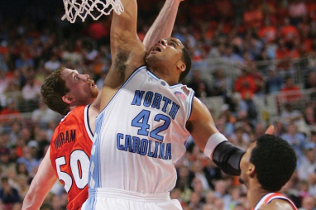 'ST. LOUIS - APRIL 04:  :  Sean May #42 of the North Carolina Tar Heels attempts a slam dunk against Jack Ingram #50 of the Illinois Fighting Illini during the NCAA Men\'s National Championship game a