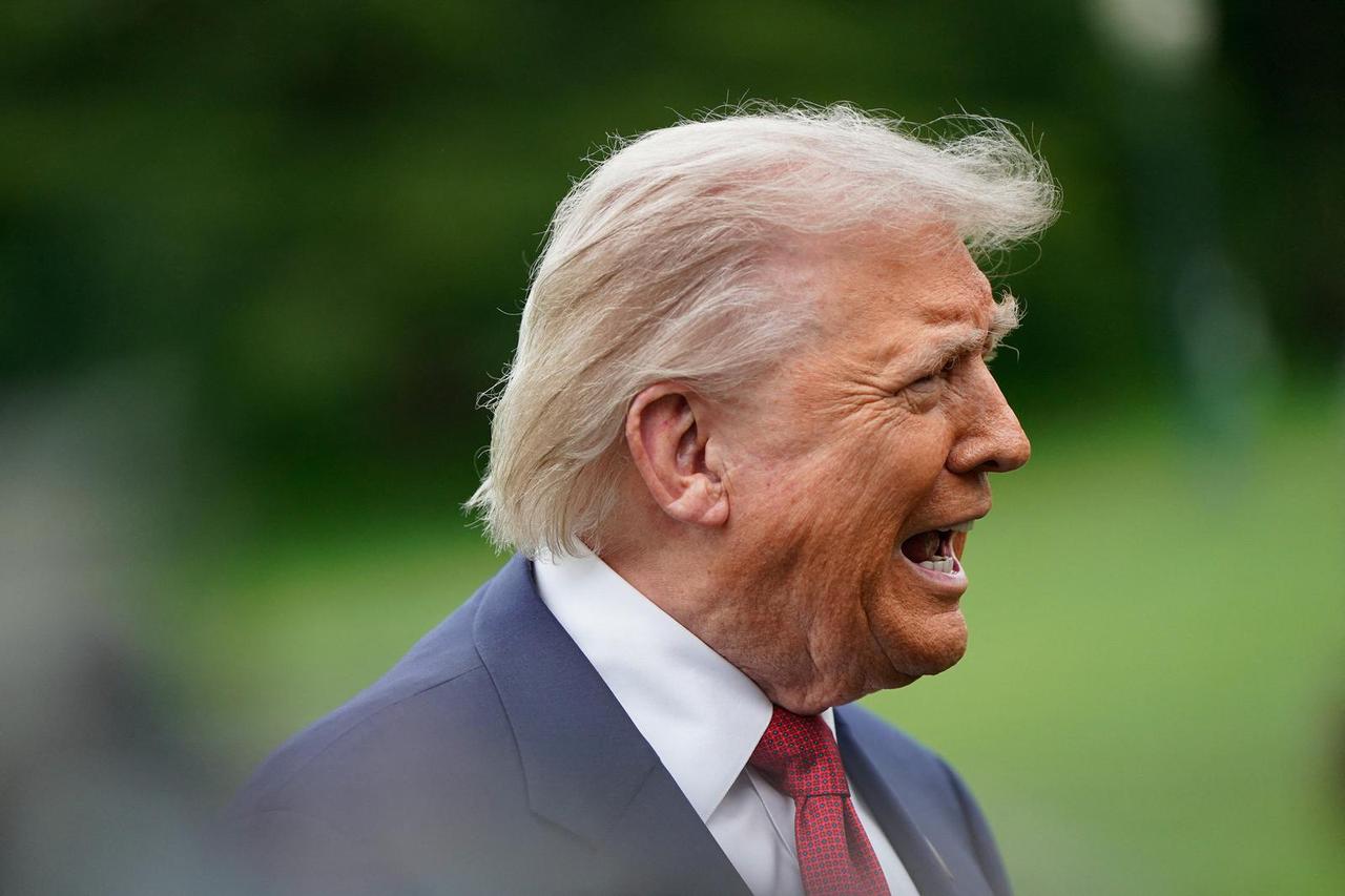 U.S. President Donald Trump talks to reporters at the White House in Washington
