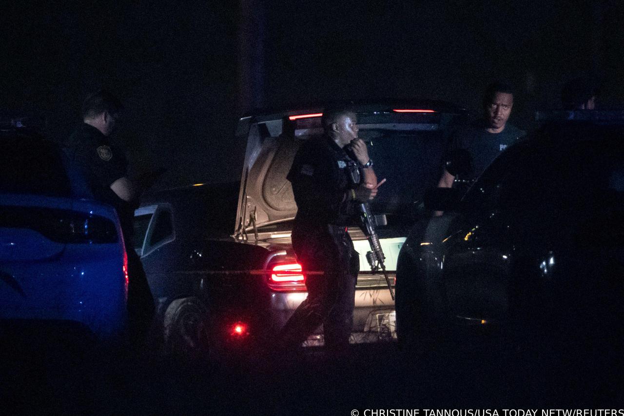 Memphis police officers work the scene where police arrested 19-year-old Ezekiel Kelly