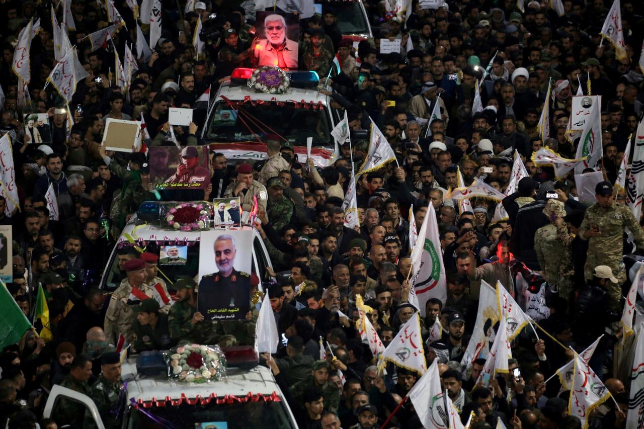 FILE PHOTO: FILE PHOTO: Mourners attend the funeral procession of the Iranian Major-General Qassem Soleimani and Iraqi militia commander Abu Mahdi al-Muhandis in Kerbala