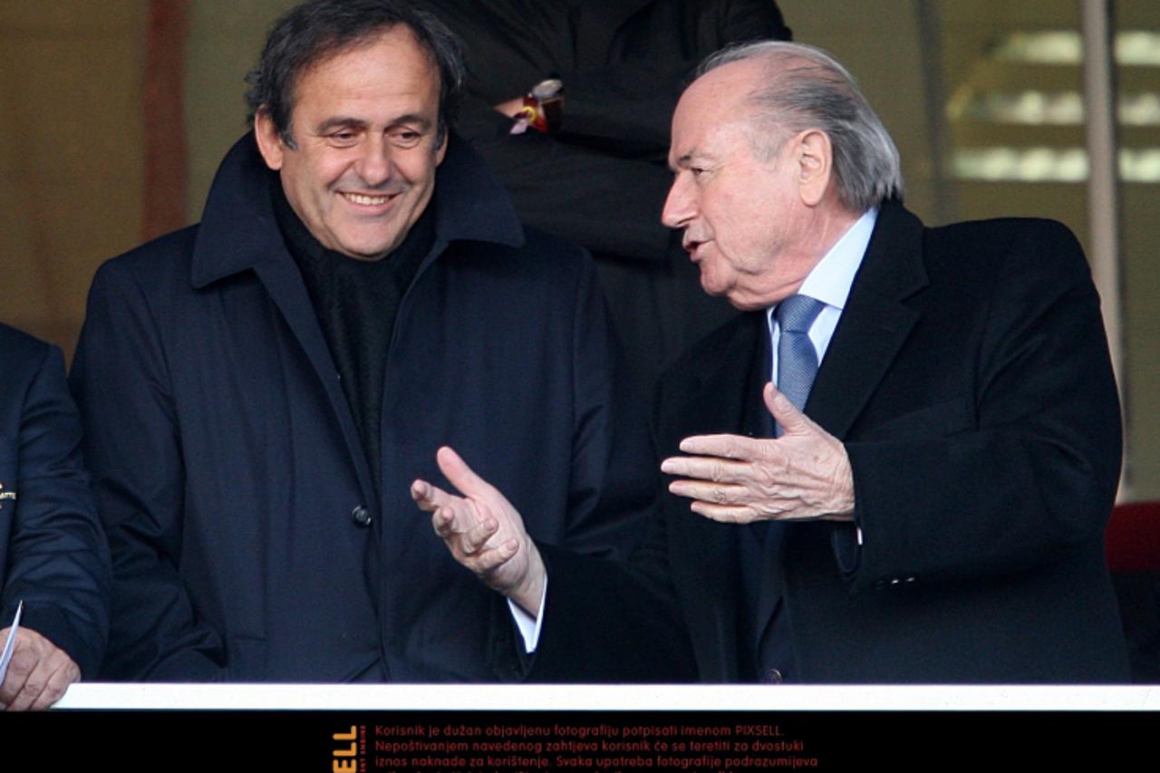 'UEFA President Michel Platini (left) and FIFA President Sepp Blatter (right) in the stands Photo: Press Association/Pixsell'