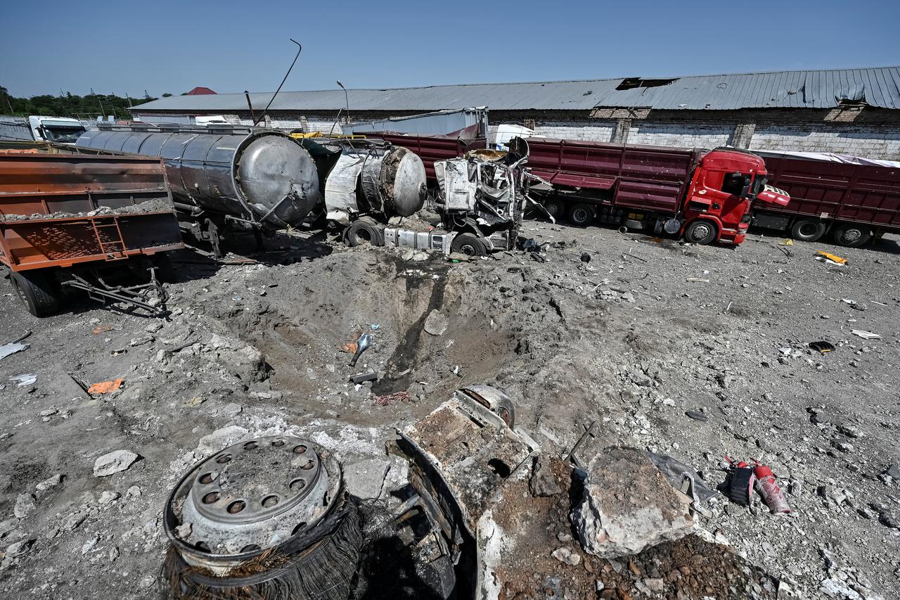 A view shows a crater at a site of an industrial area destroyed by a Russian missile strike in the village of Rozumivka