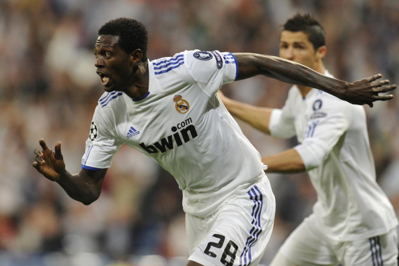 \'Real Madrid\'s Togolese forward Emmanuel Adebayor celebrates after scoring a goal during the Champions League quarter-final first leg football match Real Madrid against Tottenham Hotspur at the Sant