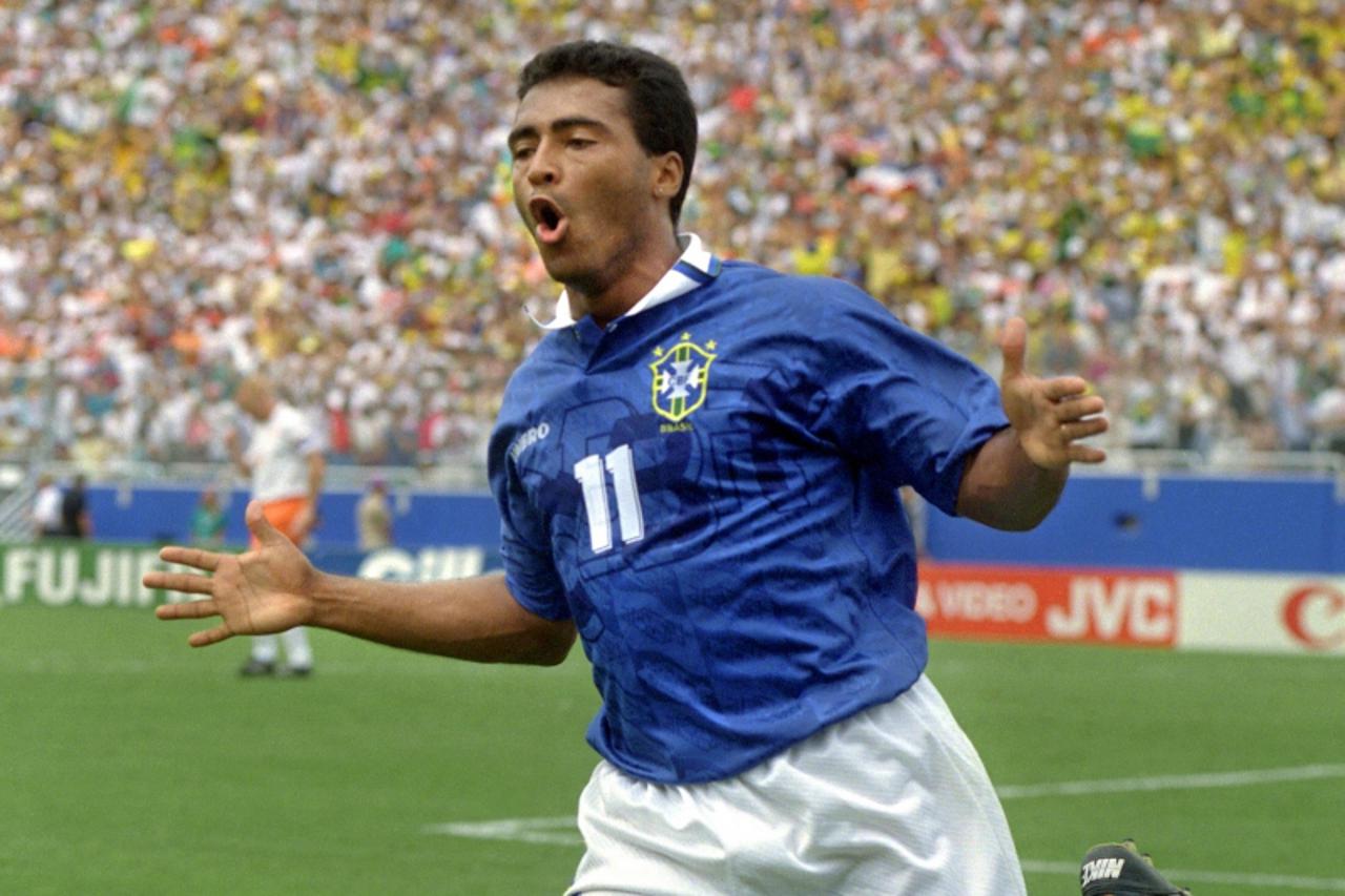 'Brazilian forward Romario jubilates after scoring a goal against the Netherlands 09 July 1994 in Dallas during their World Cup quarterfinal soccer match. Brazil won 3-2 to advance to the semifinals. 