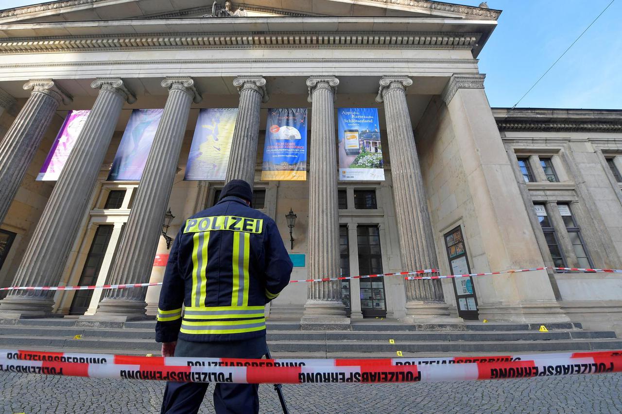 FILE PHOTO: A policeaman stands outside Green Vault city palace after a robery in Dresden