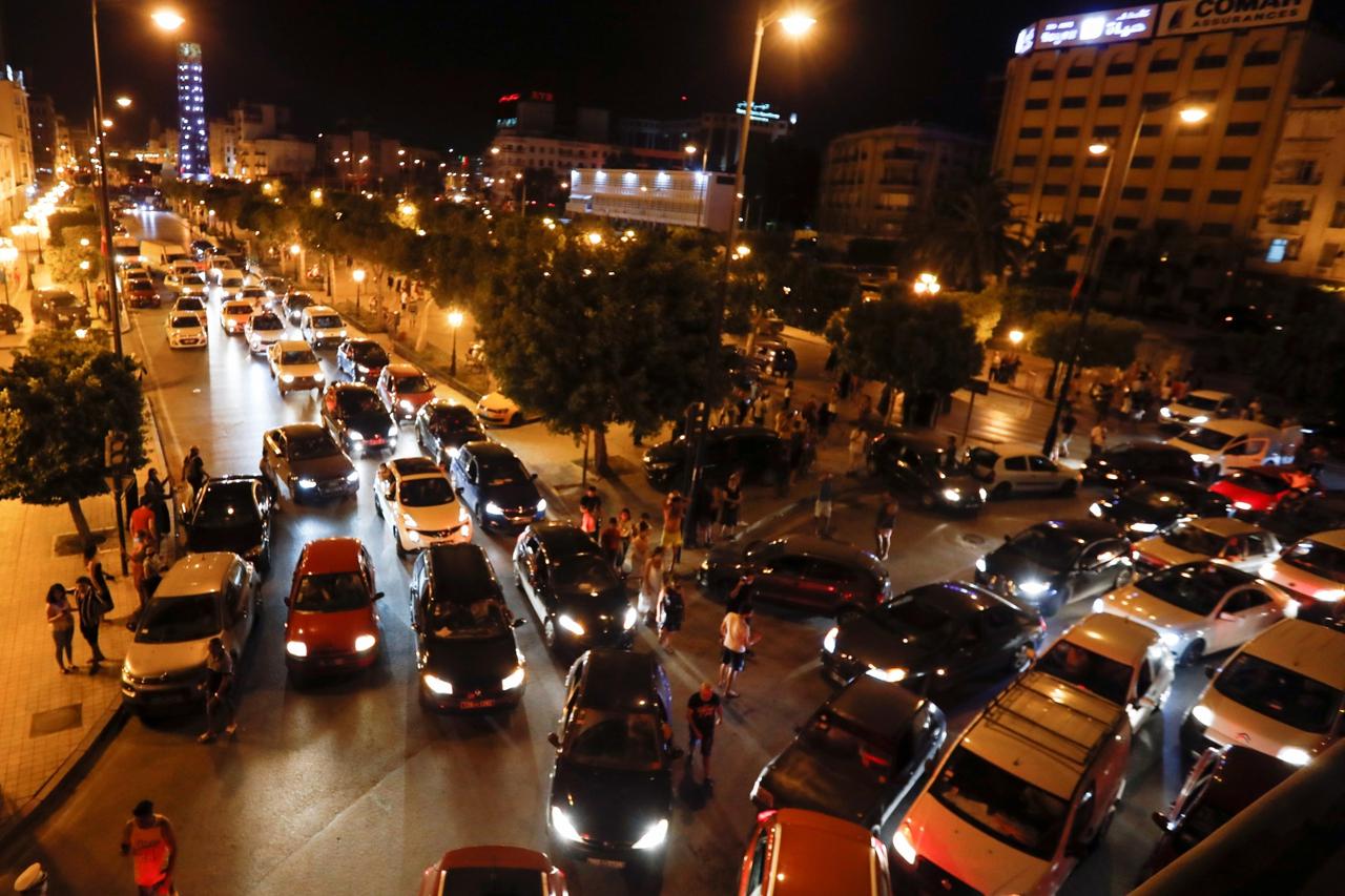 Supporters of Tunisia's President Kais Saied gather on the streets after he dismissed the government and froze parliament, in Tunis