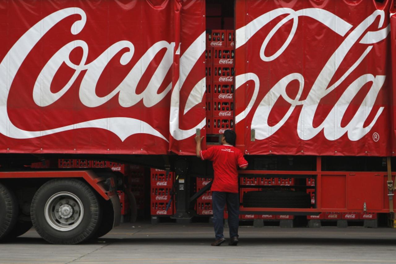 \'A worker checks his truck at PT Coca-Cola Amatil Indonesia\'s factory in Cibitung, Indonesia\'s West Java province, February 24, 2011. The Australian-based bottler and distributor for Coca Cola acro