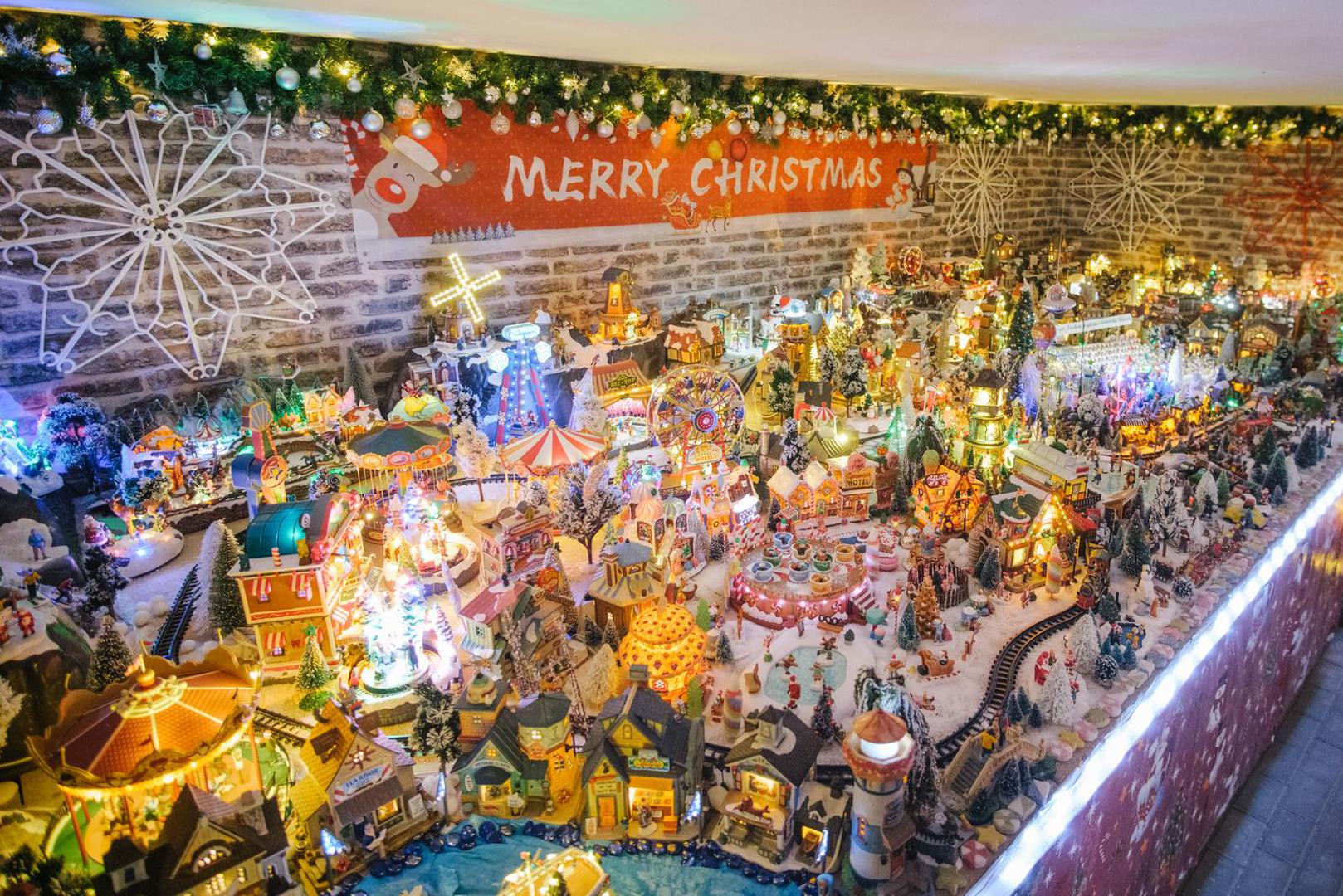 06 December 2021, Lower Saxony, Rinteln: A miniature Christmas land stands in a house in Rinteln. Thomas Jeromin has set a new world record with 444 Christmas trees in his house. The record institute for Germany was there on Monday to check and confirmed the record. Photo: Ole Spata/dpa