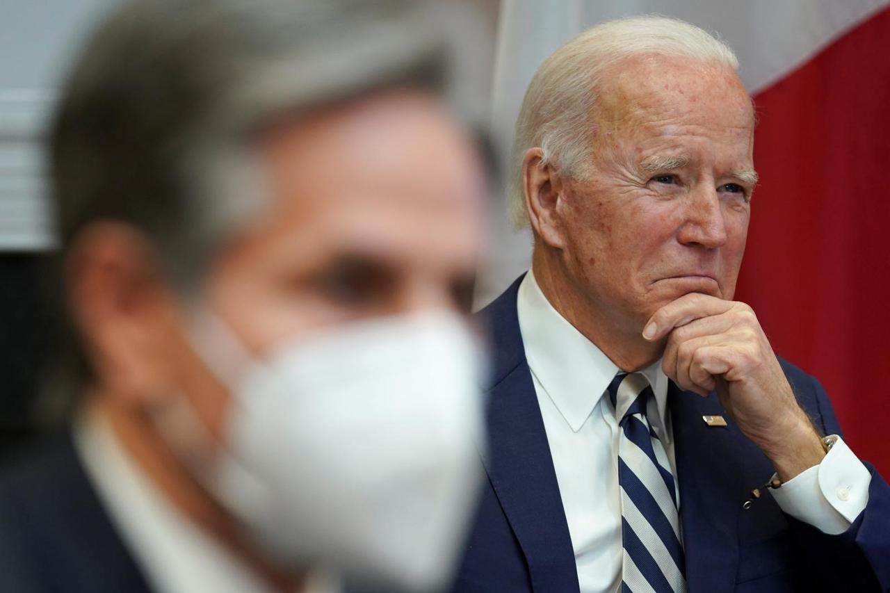 Blinken and Biden listen during a virtual meeting with Mexico President Andres Manuel Lopez from the White House in Washington