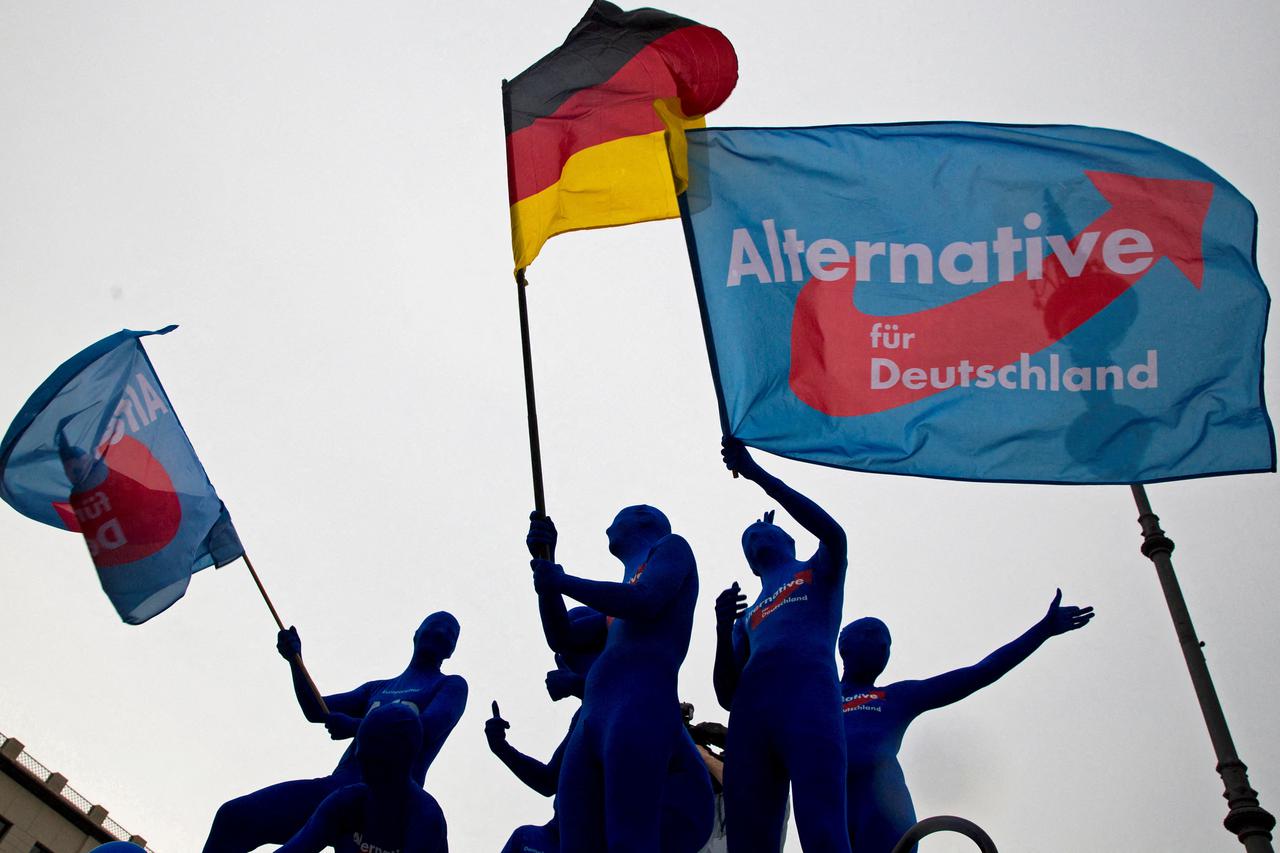 FILE PHOTO: Supporters of the AfD party wave flags during an event to rally support for Sunday's European Parliament elections in Berlin