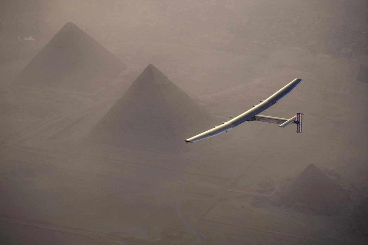 Solar Impulse 2, the solar powered plane, piloted by Swiss pioneer Andre Borschberg is seen during the flyover of the pyramids of Giza on July 13, 2016 prior to the landing in Cairo, Egypt in this photo released on July 13, 2016. Jean Revillard/SI2/Handou