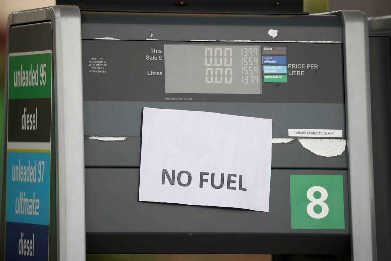 A 'No Fuel' sign is attached to an empty petrol pump at a BP filling station in Manchester