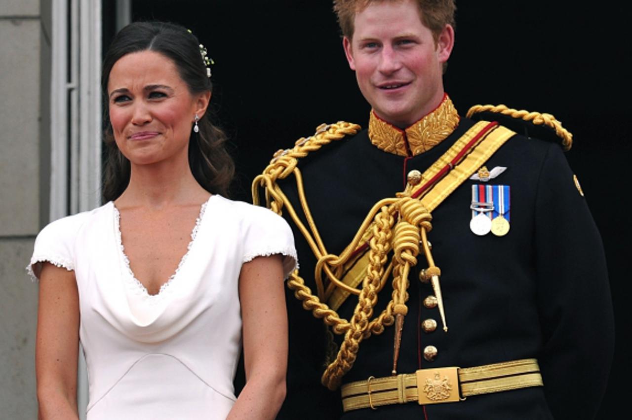 'Britain\'s Prince Harry (R) and Pippa Middleton stand on the balcony of Buckingham Palace, following following the wedding of Prince William and Kate Middleton at Westminster Abbey in London April 29