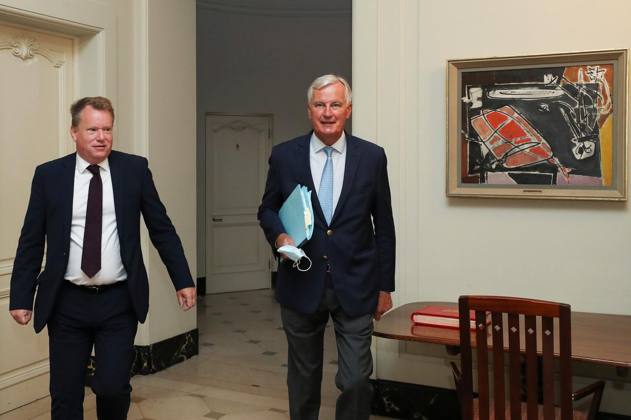 Britain's chief negotiator David Frost and EU's Brexit negotiator Michel Barnier arrive for a meeting, in Brussels