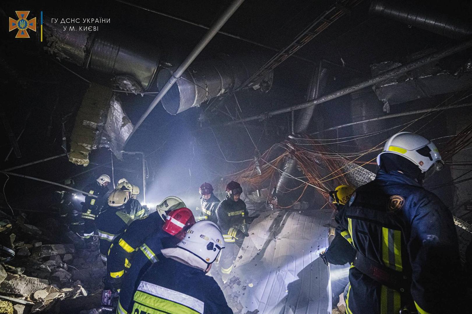 Rescuers work at the site of a shopping mall damaged by an airstrike, as Russia's attack on Ukraine continues, in Kyiv, Ukraine, in this handout picture released March 21, 2022.  Press service of the State Emergency Service of Ukraine/Handout via REUTERS ATTENTION EDITORS - THIS IMAGE HAS BEEN SUPPLIED BY A THIRD PARTY. Photo: State Emergency Service/REUTERS