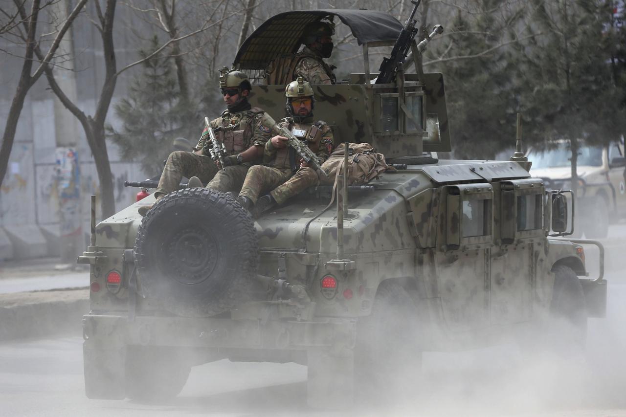 Afghan security forces arrive at the site of an attack in Kabul, Afghanistan