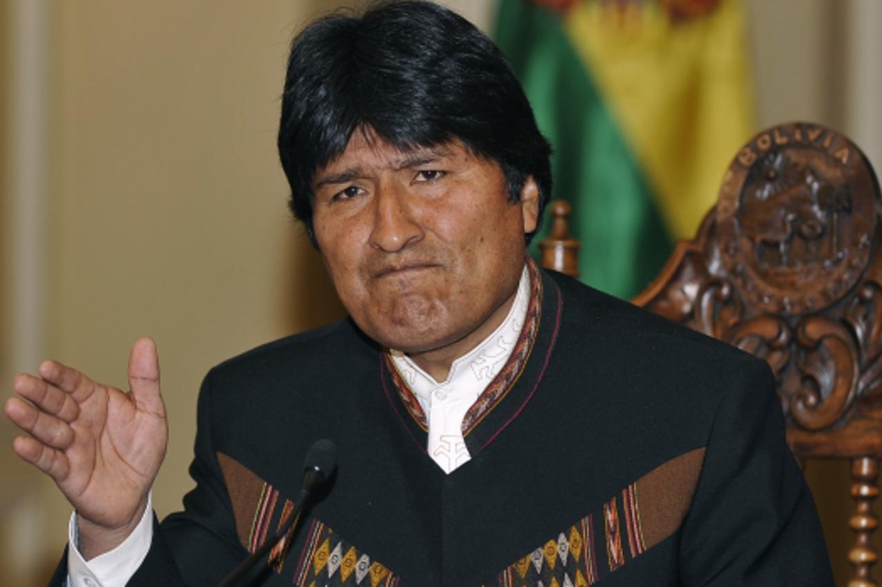 'Bolivian President Evo Morales reads a report at the presidential palace in La Paz on July 1, 2009. Morales proposed that the Organization of American States (OAS) created a tribunal to judge those r