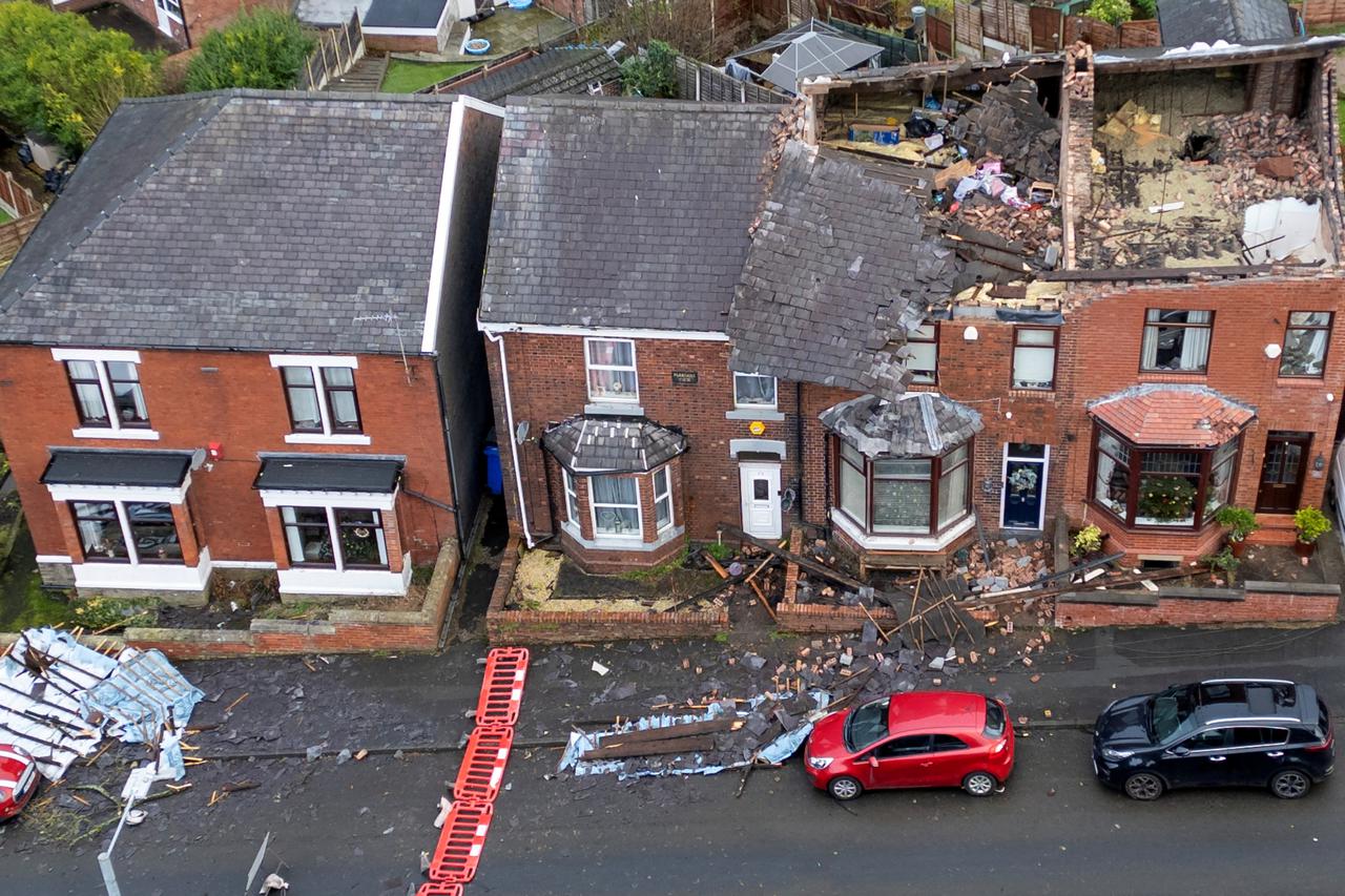 Damage is seen on the roofs of a row of terraced house after Storm Gerrit hit the country in Stalybridge