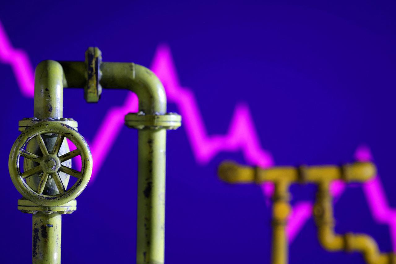 FILE PHOTO: Illustration shows natural gas pipeline and decreasing stock graph