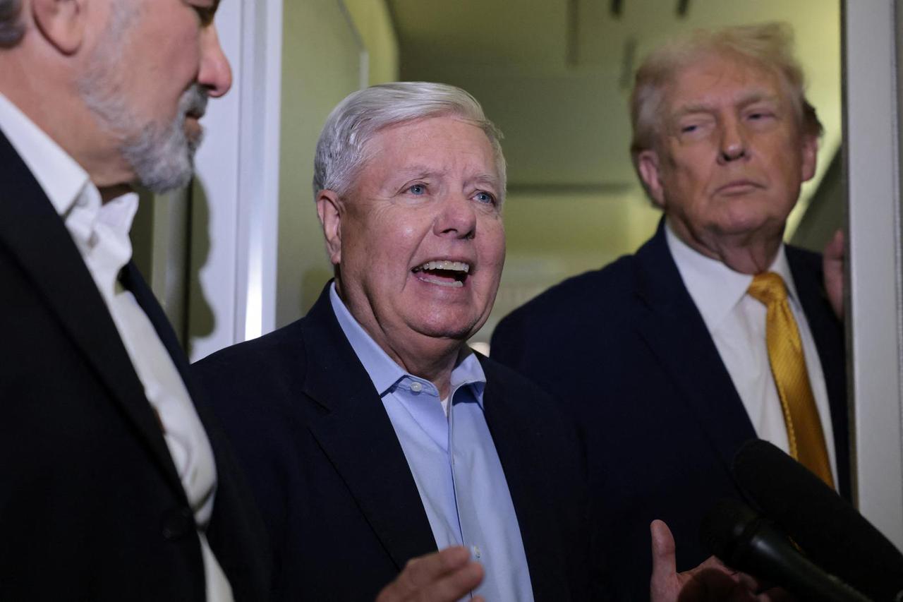 U.S. Senator Graham and President Trump speak to reporters aboard Air Force One en route to Joint Base Andrews