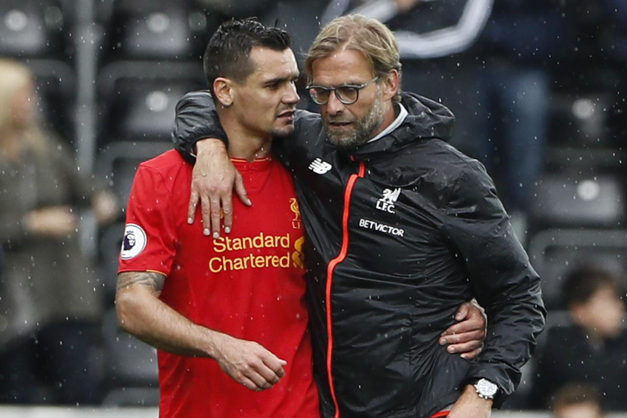Britain Soccer Football - Swansea City v Liverpool - Premier League - Liberty Stadium - 1/10/16 Liverpool manager Juergen Klopp celebrates with Dejan Lovren at the end of the match  Reuters / Stefan Wermuth Livepic EDITORIAL USE ONLY.