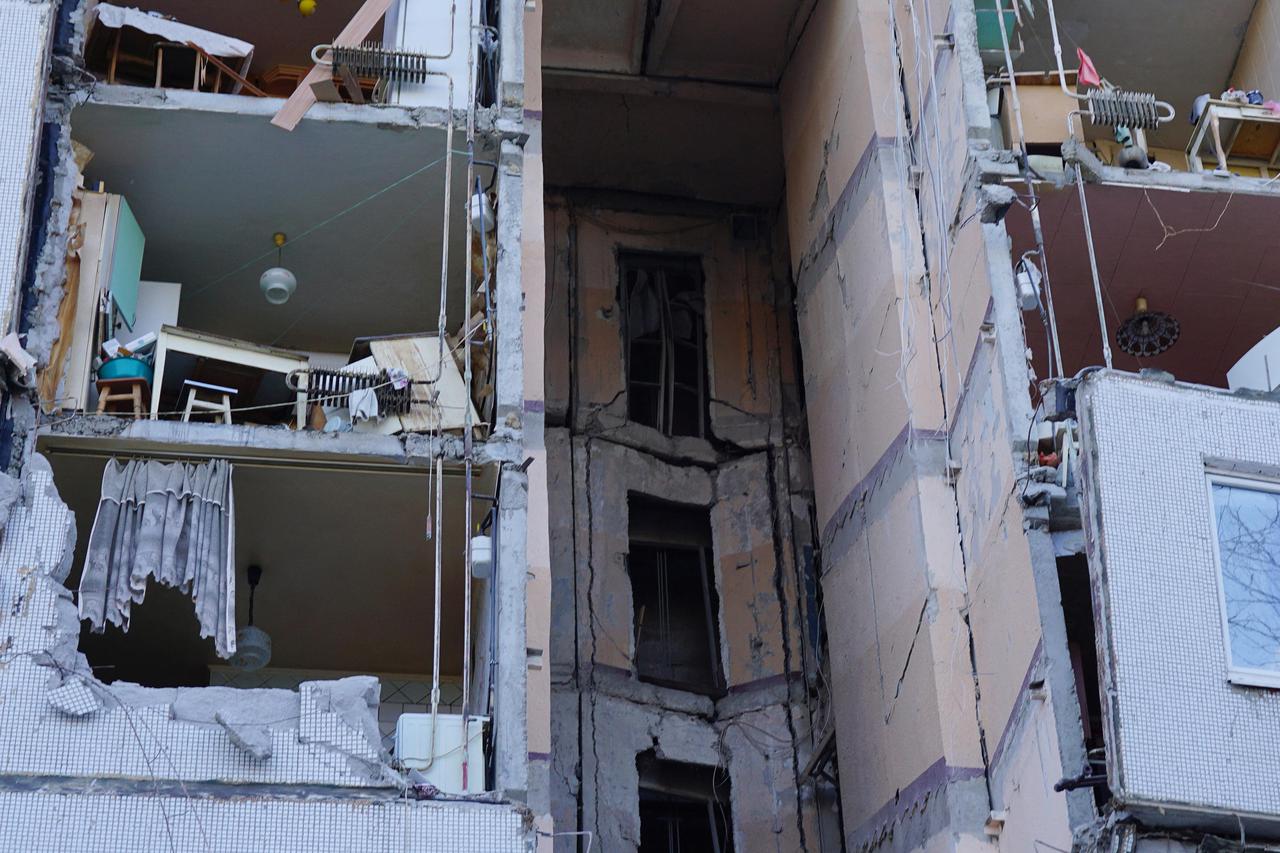 A view shows a damaged residential building in Kharkiv