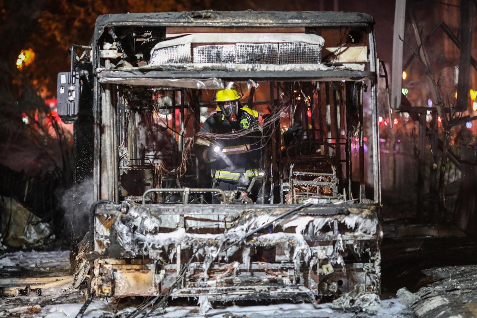 11 May 2021, Israel, Holon: An Israeli firefighter inspects a burnt bus, after it was hit by a rocket fired by the Palestinian Islamist movement Hamas from Gaza towards Israel amid the escalating flare-up of Israeli-Palestinian violence. Photo: Oren Ziv/dpa /DPA/PIXSELL