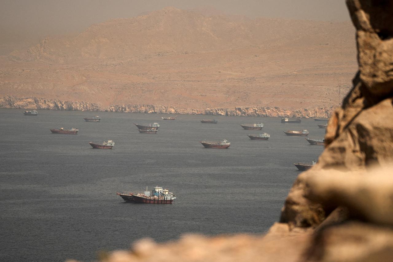 FILE PHOTO: Iran-linked vessels pass through Hormuz ahead of US blockade