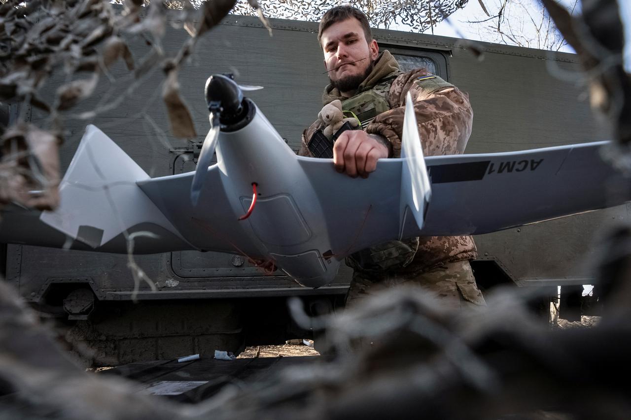 A Ukrainian serviceman of Kholodnyi Yar 93rd Separate Mechanized Brigade prepares a Furiia reconnaissance drone before a flying over positions of Russian troops, amid Russia's attack on Ukraine, near the frontline town of Bakhmut in Donetsk region