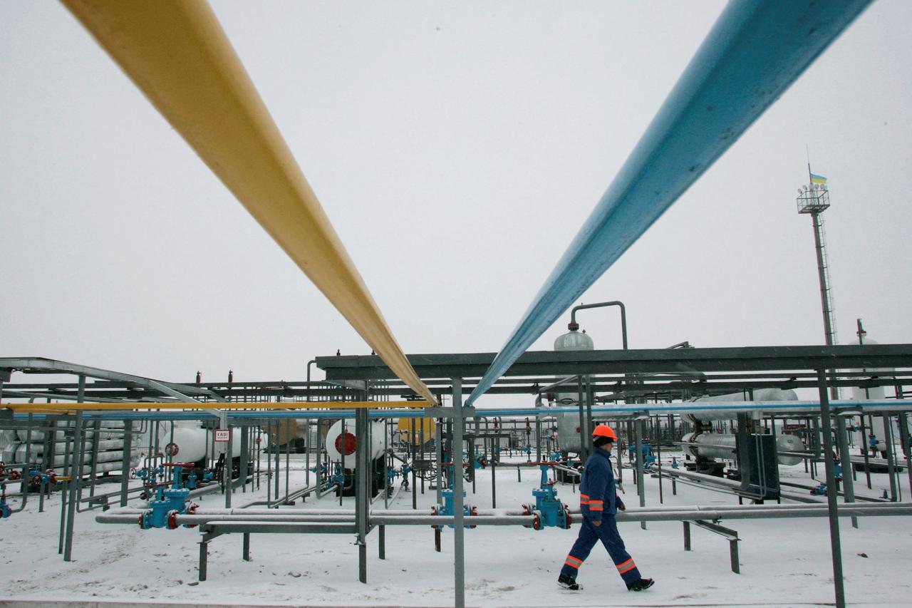 FILE PHOTO: Employee walks at gas field in Lyvenske