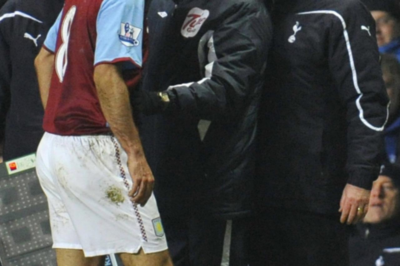 \'Tottenham Hotspurs\' manager Harry Redknapp (R) has an altercation with Aston Villa\'s Robert Pires (2nd L) during their English Premier League soccer match at Villa Park in Birmingham December 26 ,