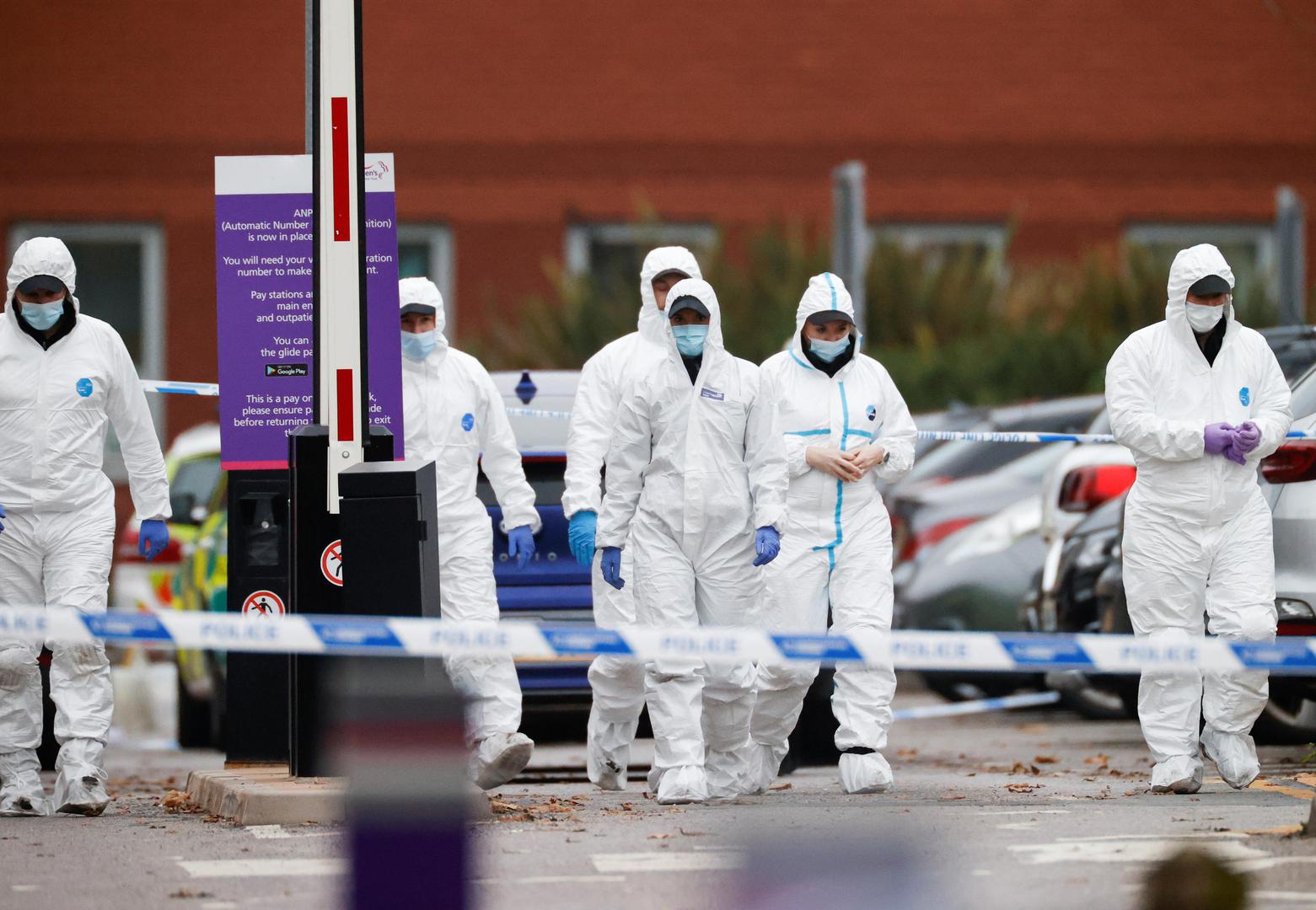 Forensic police officers leave the scene of a car blast outside Liverpool Women's Hospital, in Liverpool, Britain, November 15, 2021. REUTERS/Phil Noble