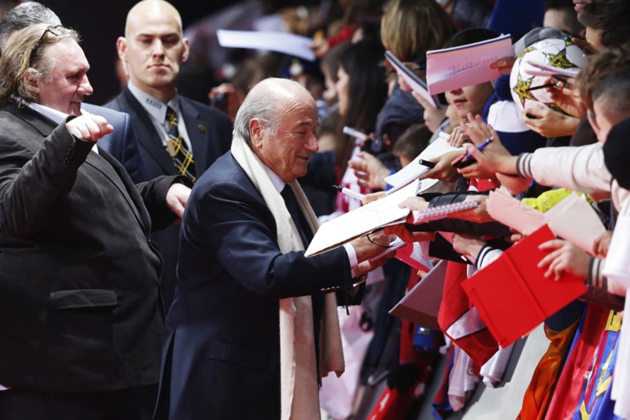 'FIFA President Sepp Blatter arrives with French actor Gerard Depardieu (L) on the red carpet before the FIFA Ballon d'Or 2012 soccer awards ceremony at the Kongresshaus in Zurich January 7, 2013. RE