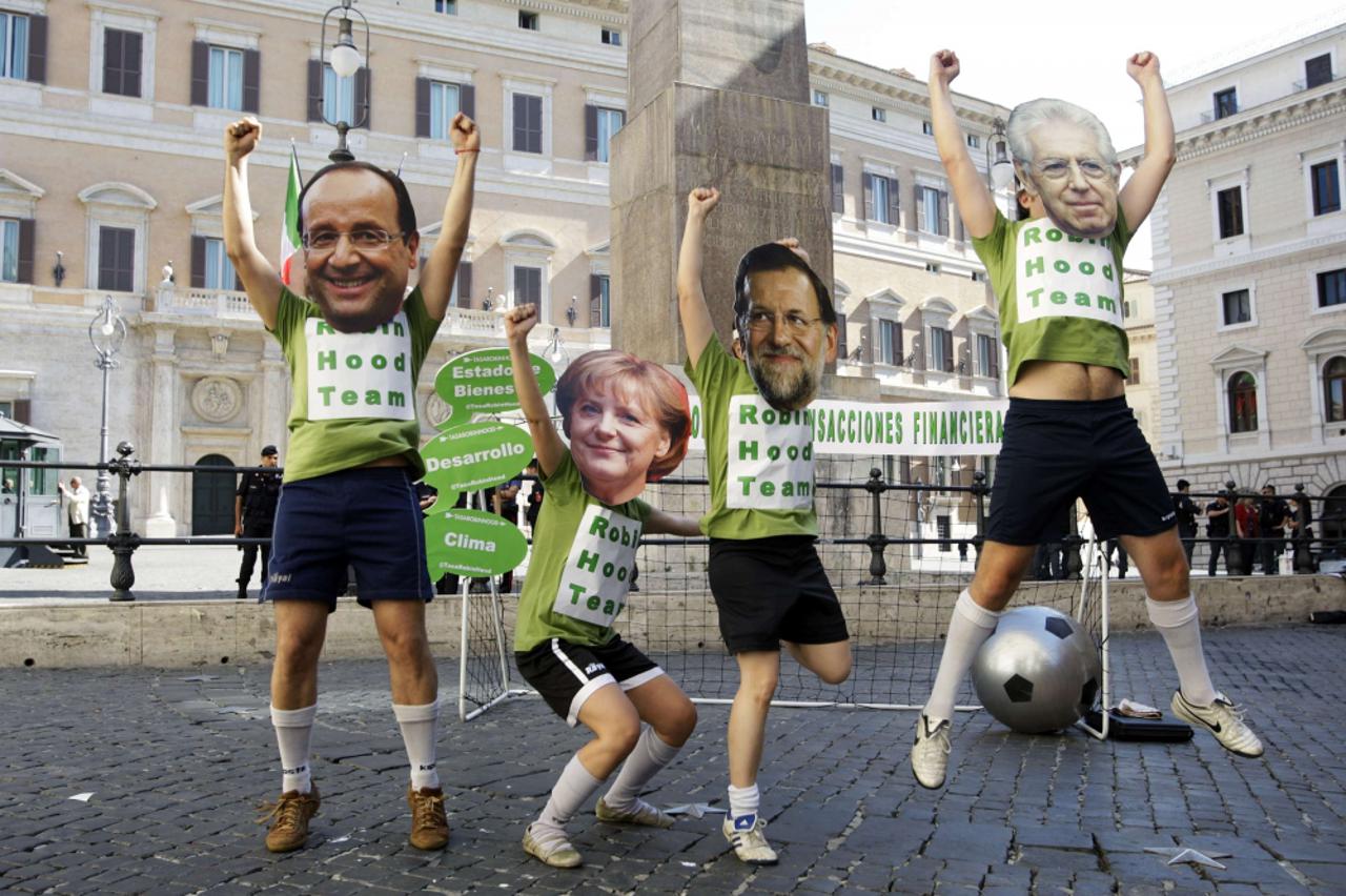 mario monti,angela merkel,